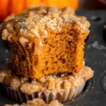 Delicious Pumpkin Streusel Muffins fresh out of the oven with a crunchy topping.